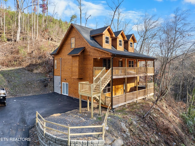 back of house featuring a garage