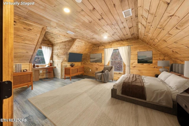 bedroom with wood walls, multiple windows, wood finished floors, and wood ceiling