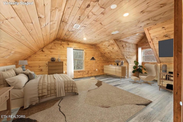 bedroom with wood walls, wood ceiling, vaulted ceiling, and wood finished floors