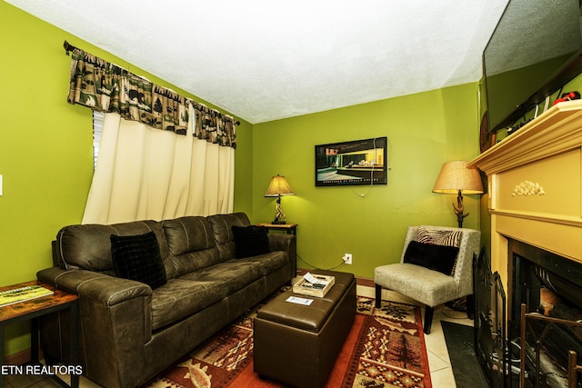 tiled living room featuring a textured ceiling