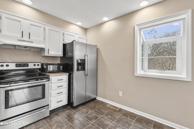 kitchen featuring white cabinets and appliances with stainless steel finishes