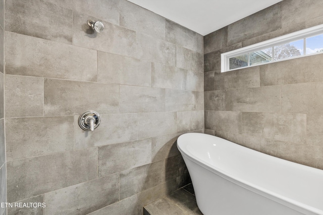 bathroom with a washtub