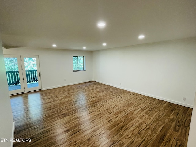 spare room featuring dark hardwood / wood-style floors