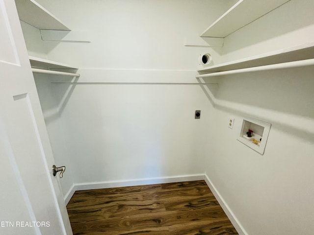 washroom with hookup for an electric dryer, hookup for a washing machine, and dark wood-type flooring