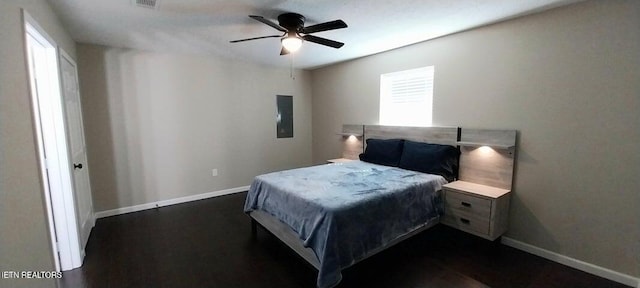 bedroom featuring ceiling fan and dark hardwood / wood-style flooring