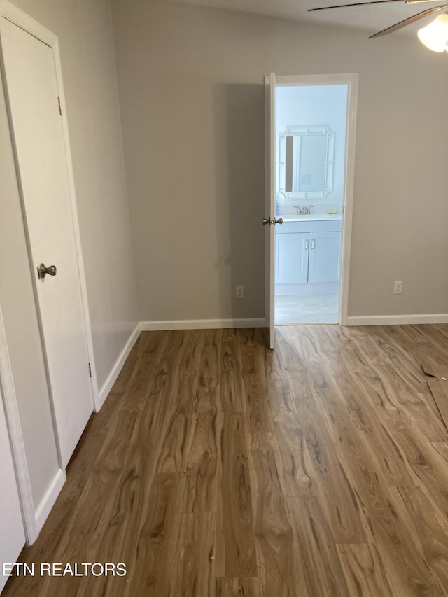 unfurnished room with hardwood / wood-style floors and ceiling fan