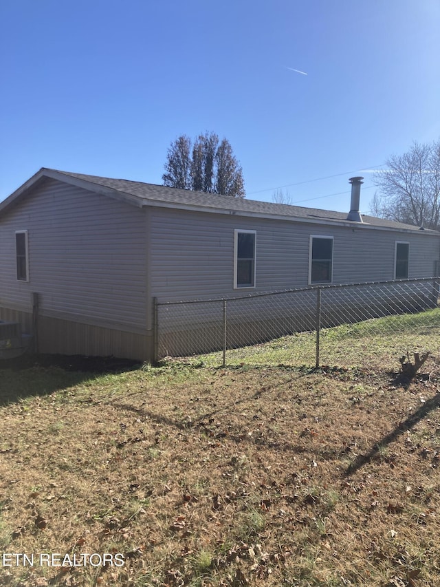 view of property exterior with a lawn