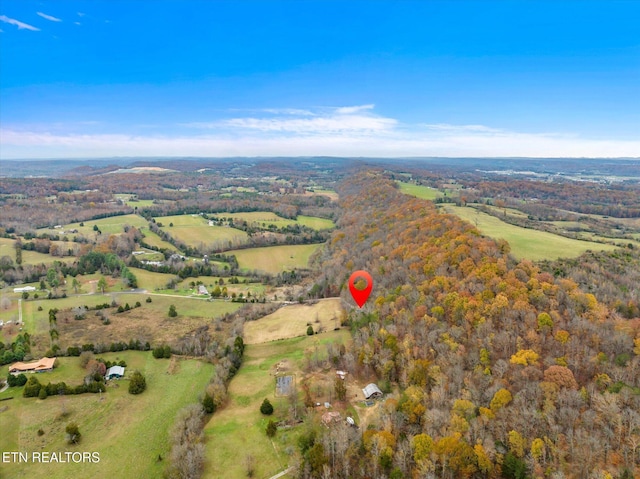 birds eye view of property featuring a rural view