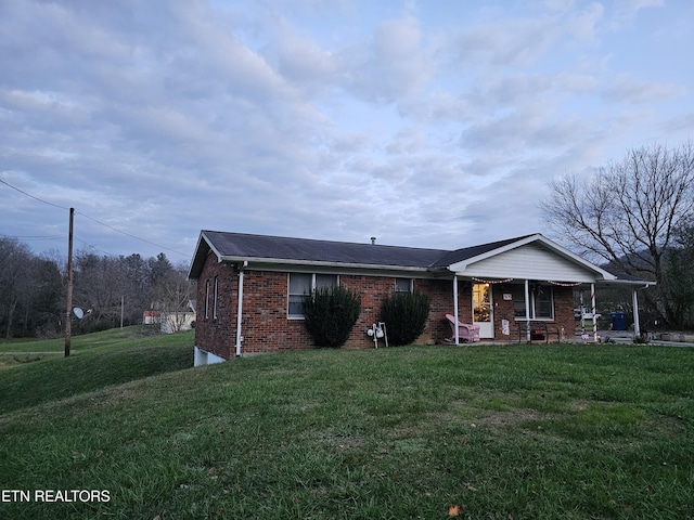 view of front facade with covered porch and a front lawn