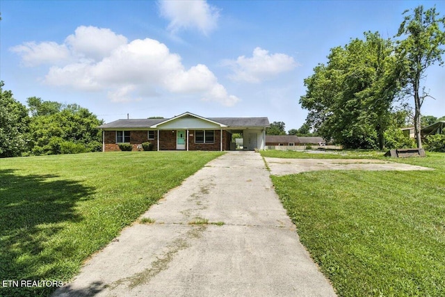 505 S S 38th St, Middlesboro, KY 40965 - ranch-style home featuring driveway, a front yard, brick siding, a carport, and a porch