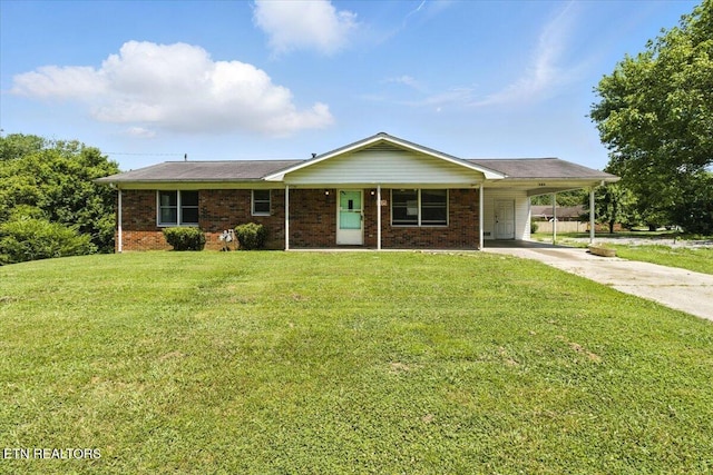 505 S S 38th St, Middlesboro, KY 40965 - single story home featuring concrete driveway, a carport, a front lawn, brick siding, and covered porch