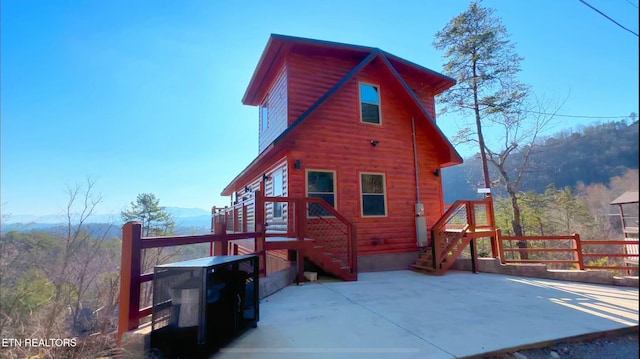 rear view of house with a mountain view