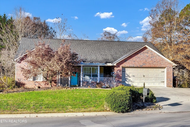 ranch-style house featuring a porch, a garage, and a front lawn