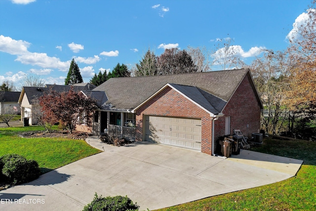 view of front facade with a front yard and a garage