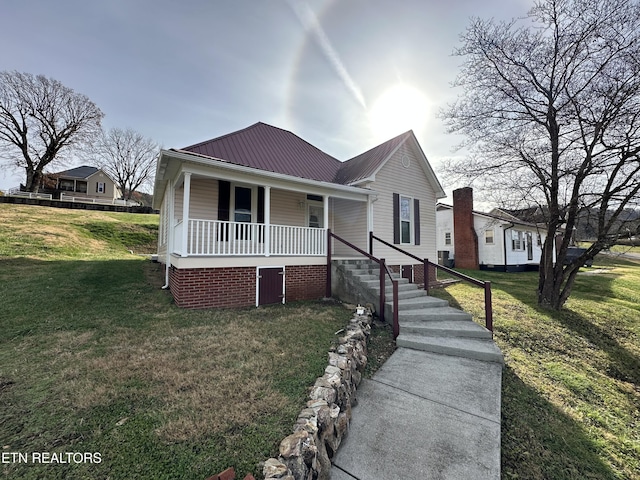 bungalow-style house featuring a porch and a front lawn