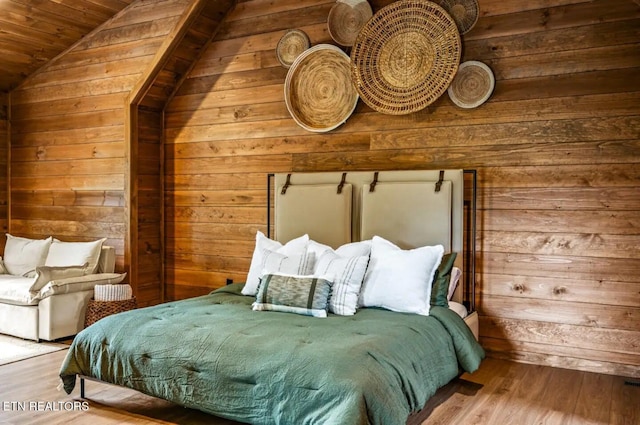 bedroom with wood walls, wood-type flooring, wood ceiling, and vaulted ceiling