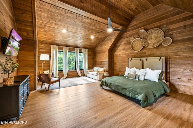 bedroom featuring light wood-type flooring, lofted ceiling, and wood ceiling