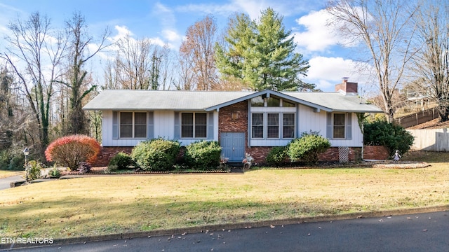 ranch-style house with a front lawn