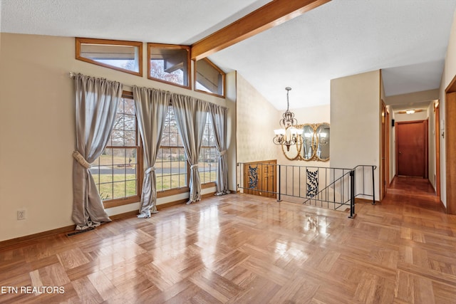 unfurnished room featuring lofted ceiling with beams, a healthy amount of sunlight, parquet floors, and a chandelier