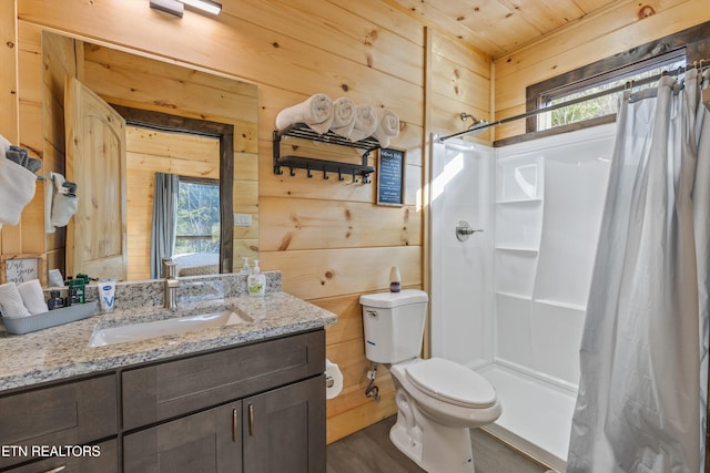 bathroom with wooden walls, walk in shower, and a wealth of natural light