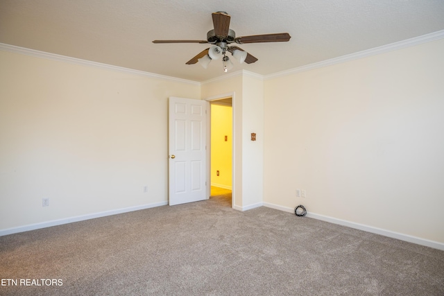 unfurnished room with crown molding, ceiling fan, and light colored carpet