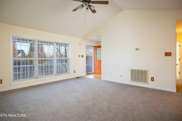 spare room featuring ceiling fan, light colored carpet, and lofted ceiling