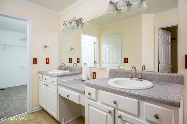 bathroom with tile patterned floors, vanity, and crown molding