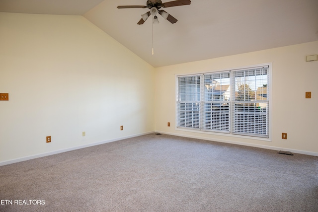 carpeted spare room featuring ceiling fan and lofted ceiling