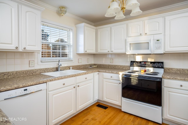 kitchen with light hardwood / wood-style floors, white cabinetry, white appliances, and sink