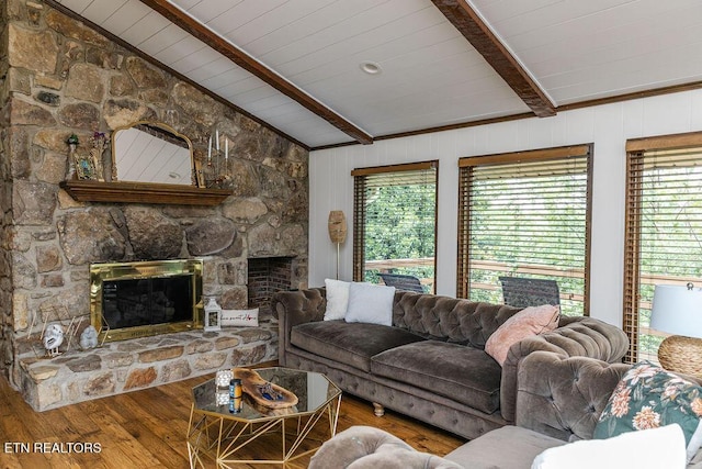 living room featuring a stone fireplace, vaulted ceiling with beams, hardwood / wood-style floors, wooden walls, and wood ceiling