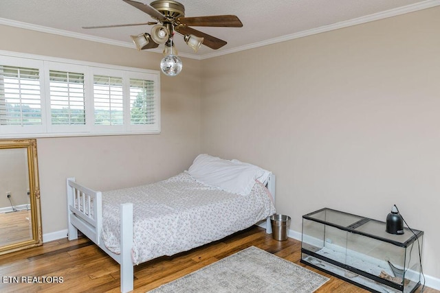 bedroom featuring multiple windows, ceiling fan, and dark wood-type flooring