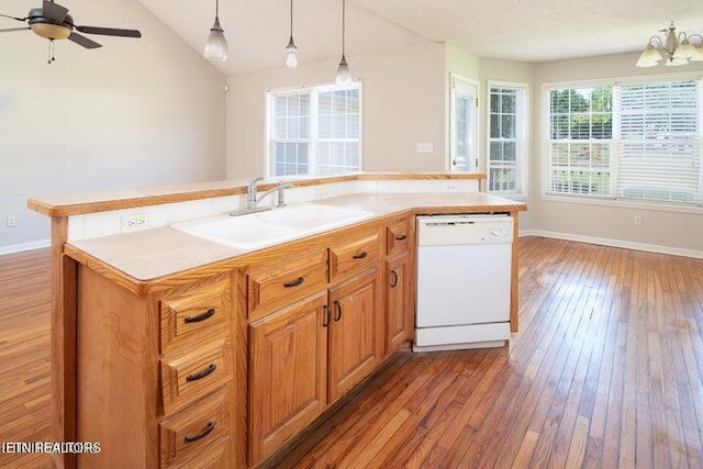 kitchen with ceiling fan with notable chandelier, dark wood-type flooring, sink, dishwasher, and a kitchen island