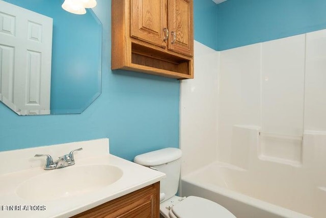 full bathroom with shower / bathing tub combination, vanity, and toilet