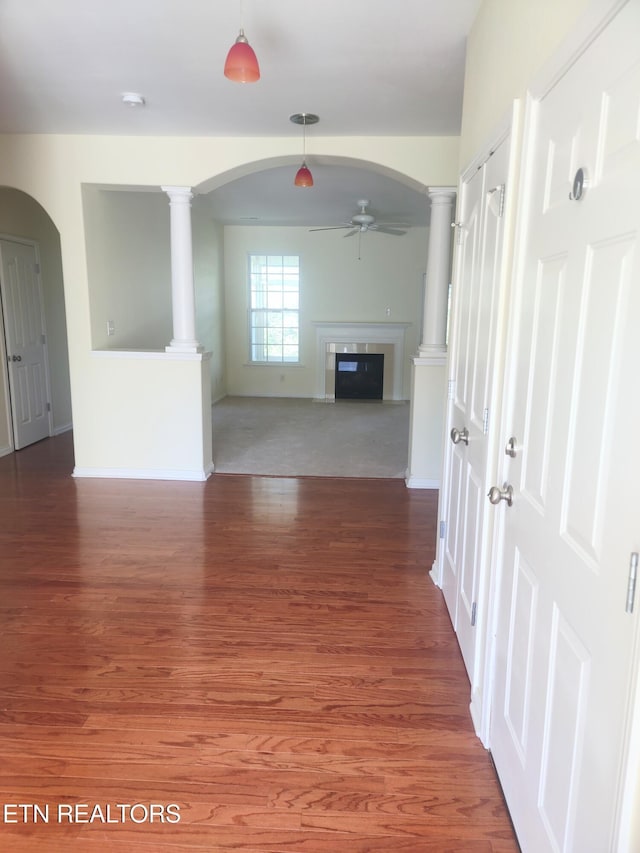 hallway with dark hardwood / wood-style flooring