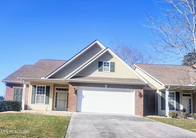 view of front of house with a front yard and a garage