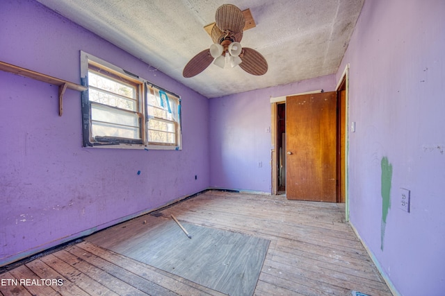 unfurnished room with ceiling fan and light hardwood / wood-style flooring