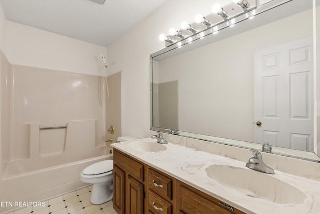 full bathroom with vanity, washtub / shower combination, and toilet