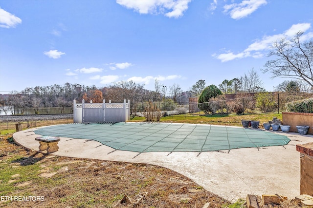 view of swimming pool with a patio area