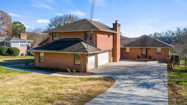 view of side of property featuring a yard and a garage