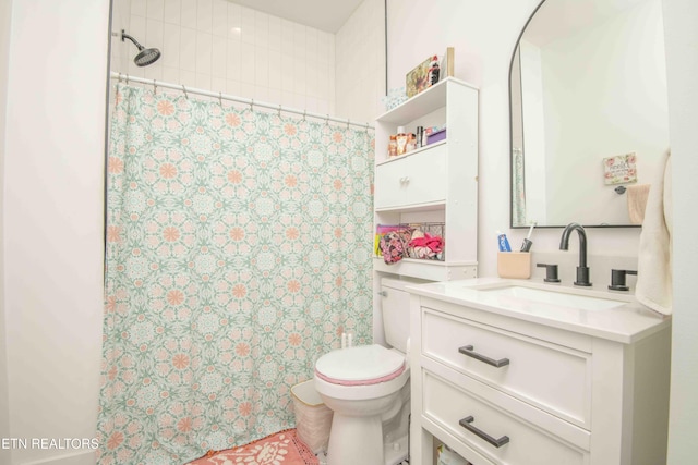 bathroom with vanity, toilet, and walk in shower