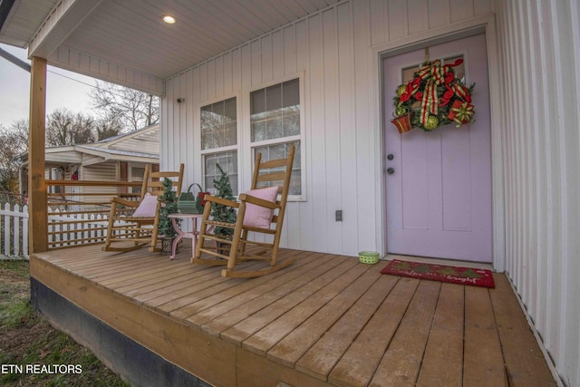 wooden terrace featuring covered porch