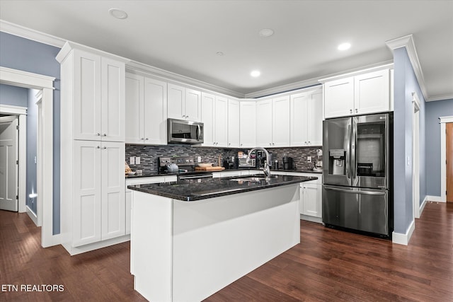 kitchen with white cabinets, sink, stainless steel appliances, and dark wood-type flooring