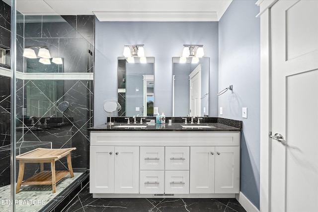 bathroom with vanity, a shower with door, and crown molding