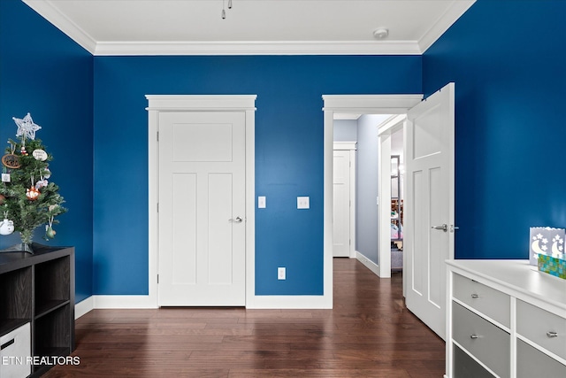 bedroom featuring dark hardwood / wood-style floors and ornamental molding