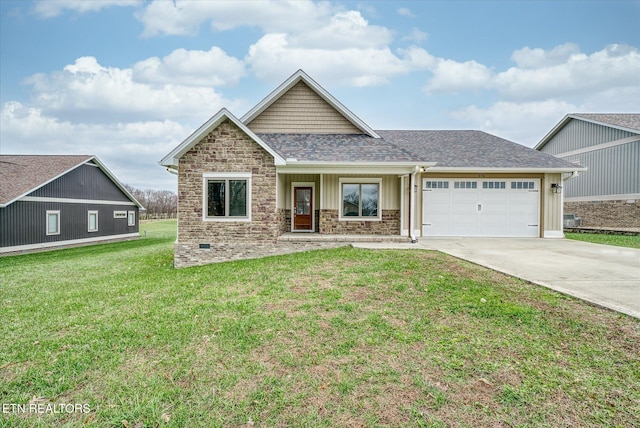 view of front of house featuring a front lawn and a garage