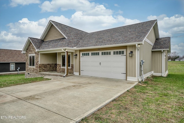 view of front of house with a front lawn and a garage