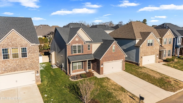 view of front of property with a front yard and a garage