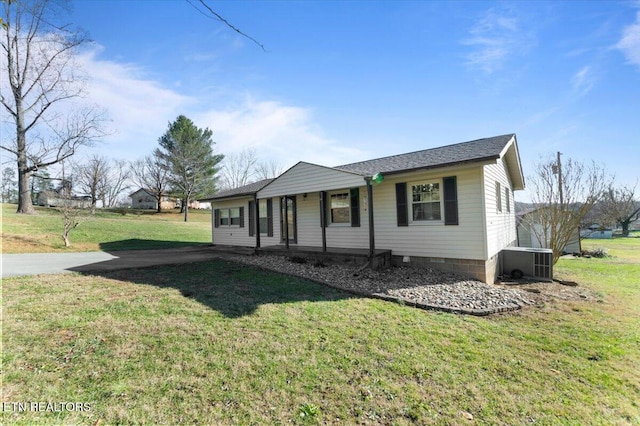 single story home with central AC unit, covered porch, and a front yard