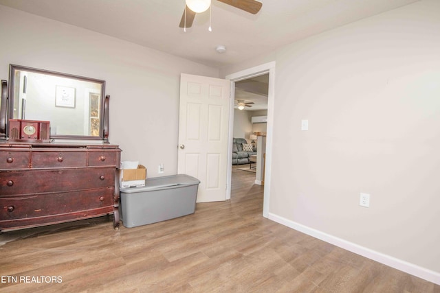 bedroom with light wood-type flooring and ceiling fan