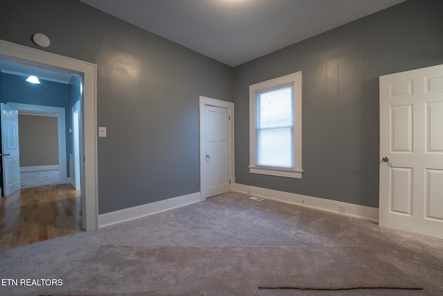 unfurnished bedroom with carpet